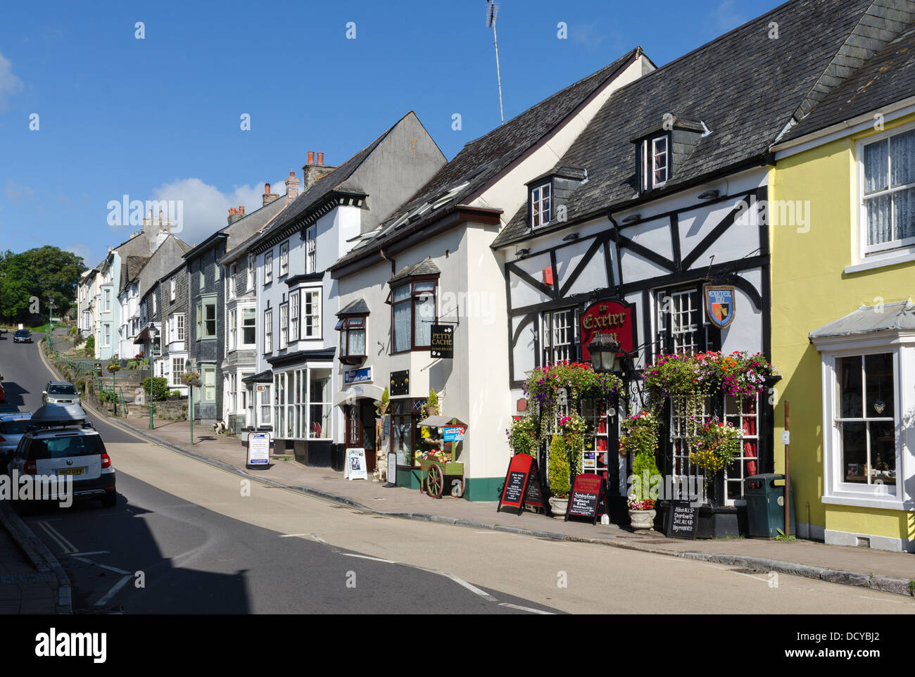Shops and houses and the Exeter Inn public house on Church Street, Modbury, Devon Stock Photo