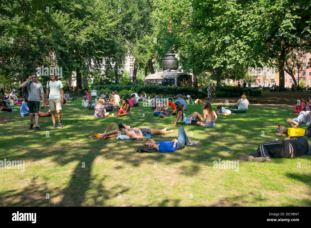 Young people enjoying a summer''s day in Union Square Park in NYC Stock Photo