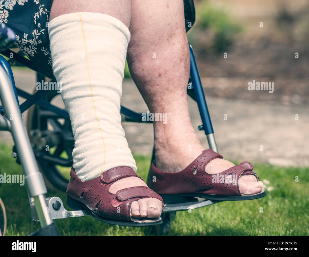 Senior persons legs in wheelchair Stock Photo Alamy