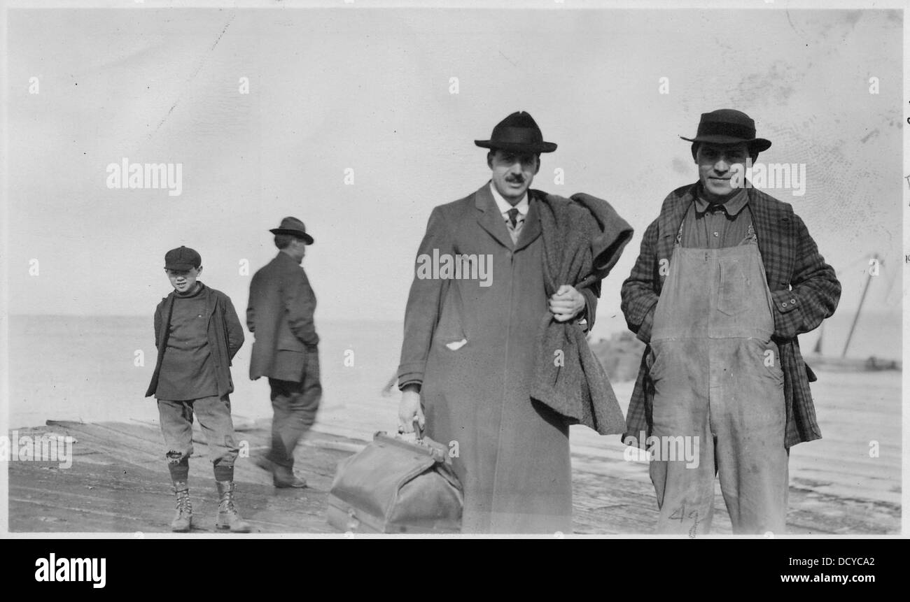 Left to right, child, unidentified man, Boxman, Alex Guthrie ...