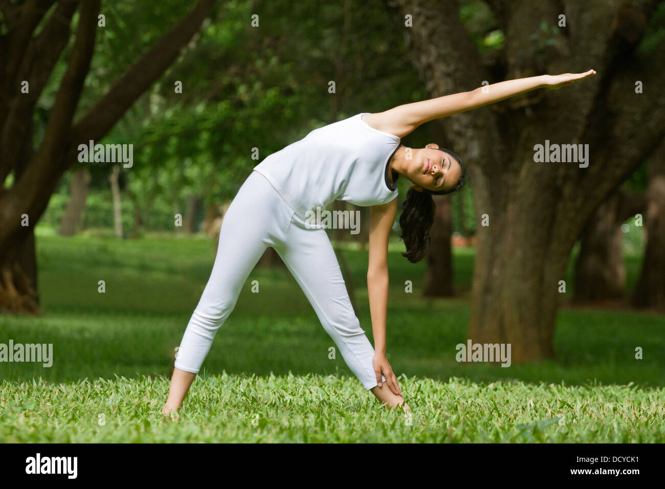 Young woman exercising in a park Stock Photo - Alamy