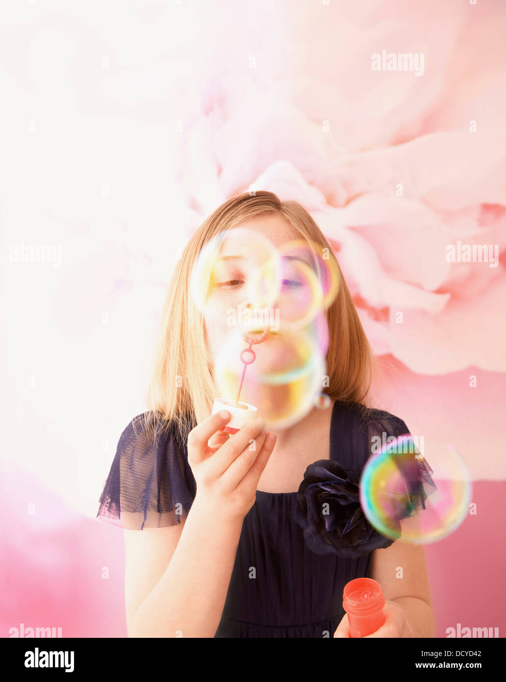 Teen girl blowing soap bubbles hi-res stock photography and images - Alamy
