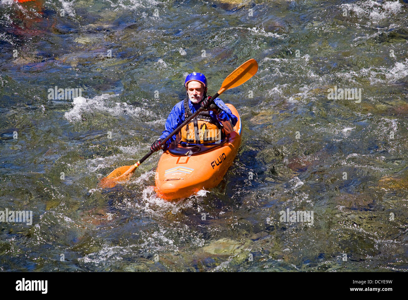 A kayaker on the Upper McKenzie River in the central Oregon Cascade Mountains. Stock Photo