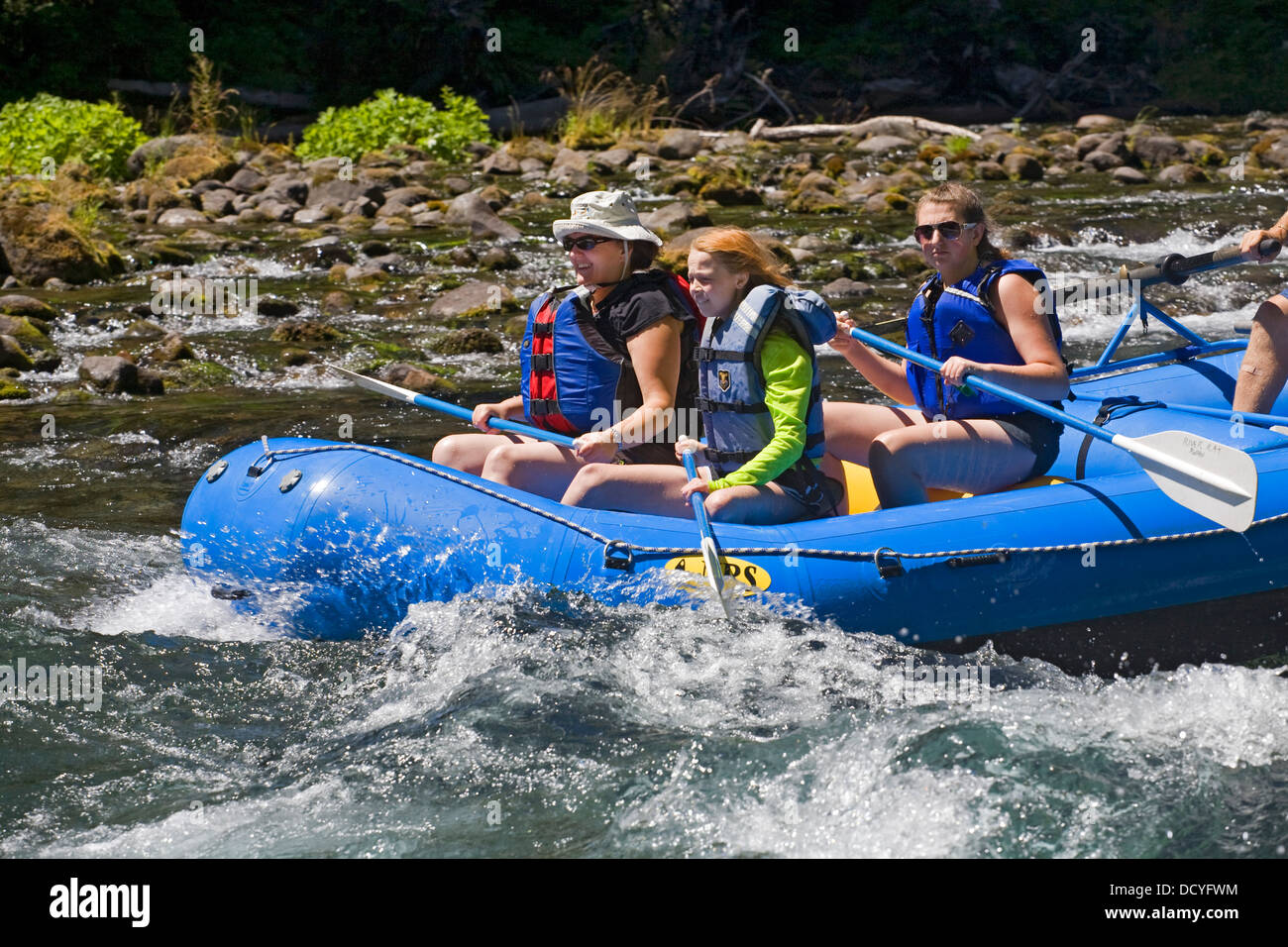 A family of white water rafters on the Upper McKenzie River in the Oregon Cascade Mountains Stock Photo