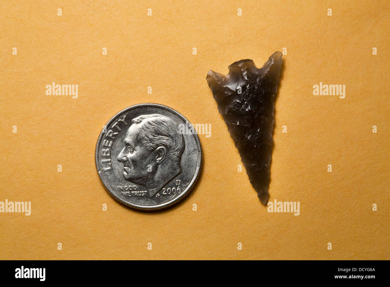 Small obsidian indian arrowhead called a bird point, central oregon Stock Photo