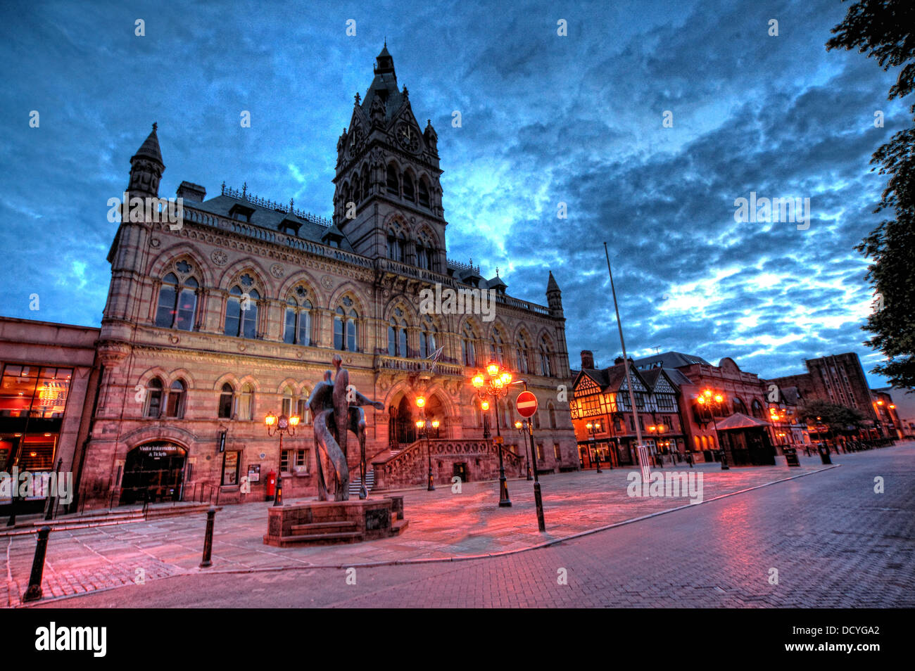 Chester Town Hall illuminated at dusk in the city centre of Chester, Cheshire, England, with unusual deep blue evening sky overhead. Stock Photo