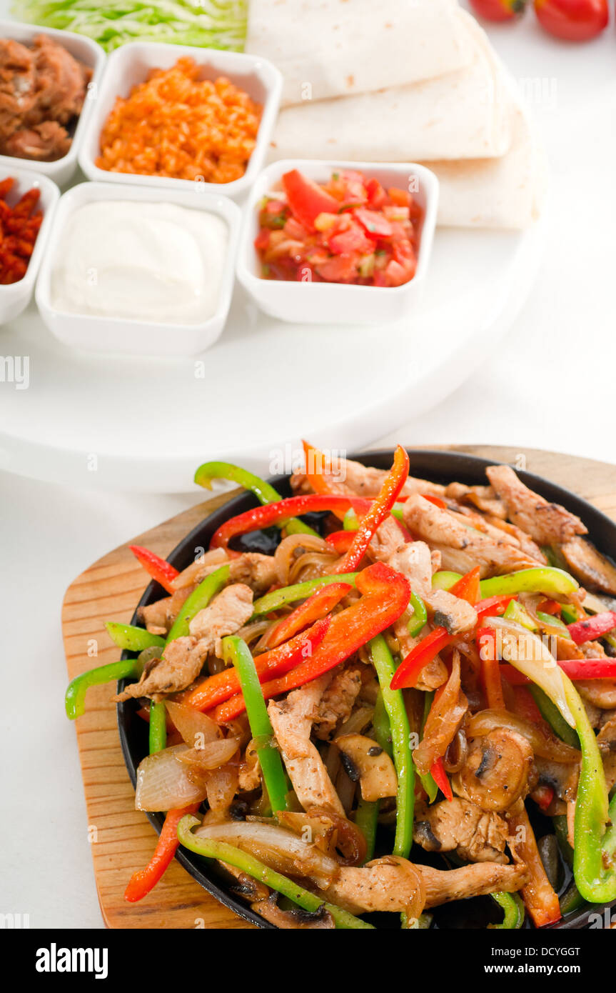 original fajita sizzling hot on iron plate Stock Photo Alamy