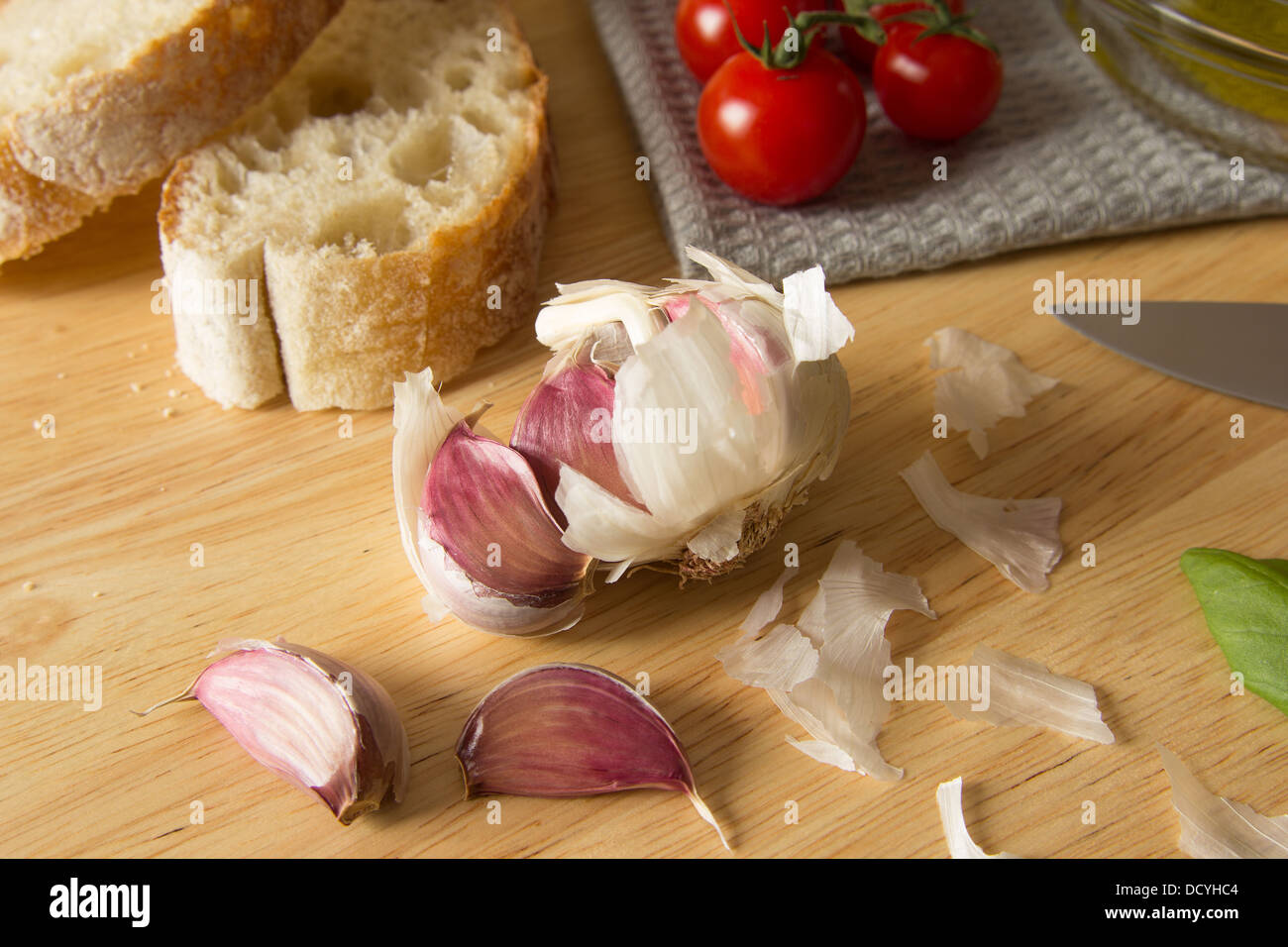 A still life with ciabatta, olive oil, garlic, tomatoes and basil Stock