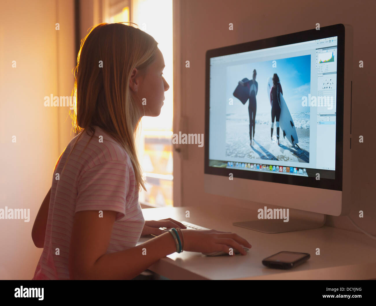 Girl Staring At Her Computer Monitor Stock Photo