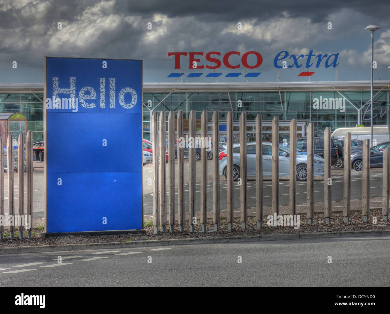 Tesco Extra store with heavy grey clouds , Winwick Road, Warrington, Cheshire, England, WA2 7NE Stock Photo