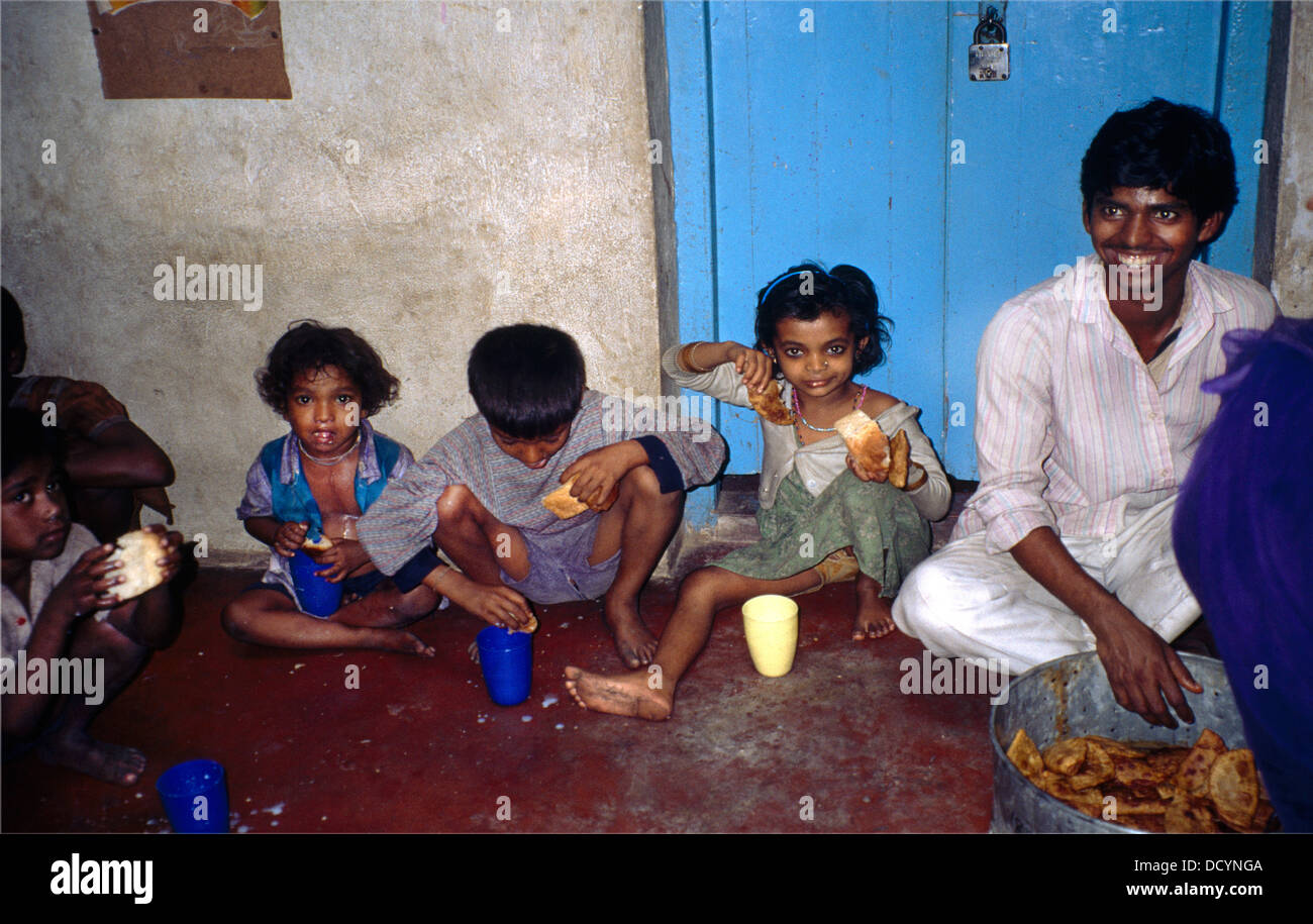 kolkata India School Children Eating Meal Sitting on Floor Stock Photo