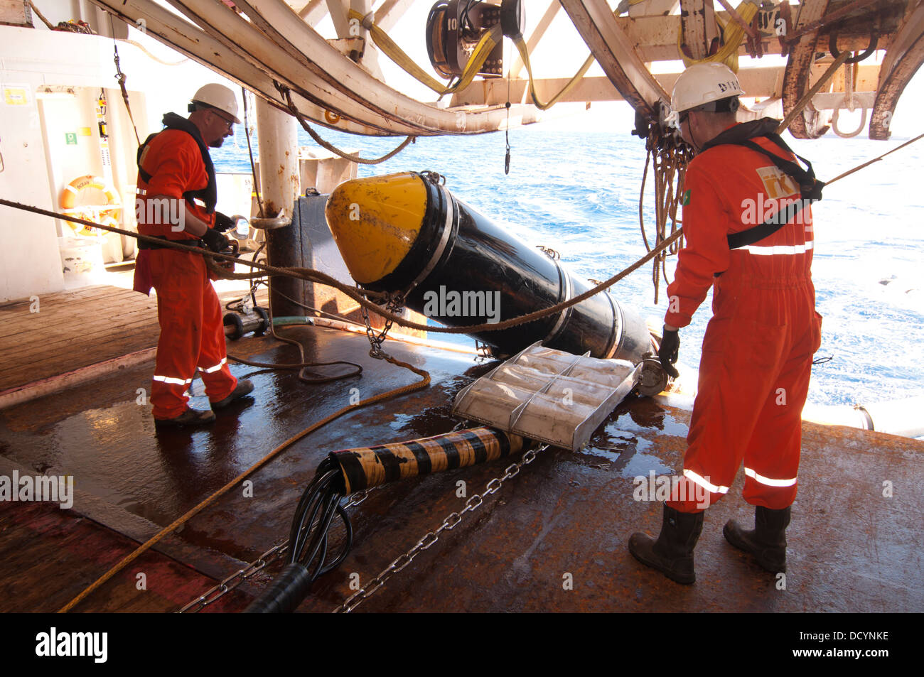 Gun Mechanics working on Seismic Air guns at Gun Deck in the seismic
