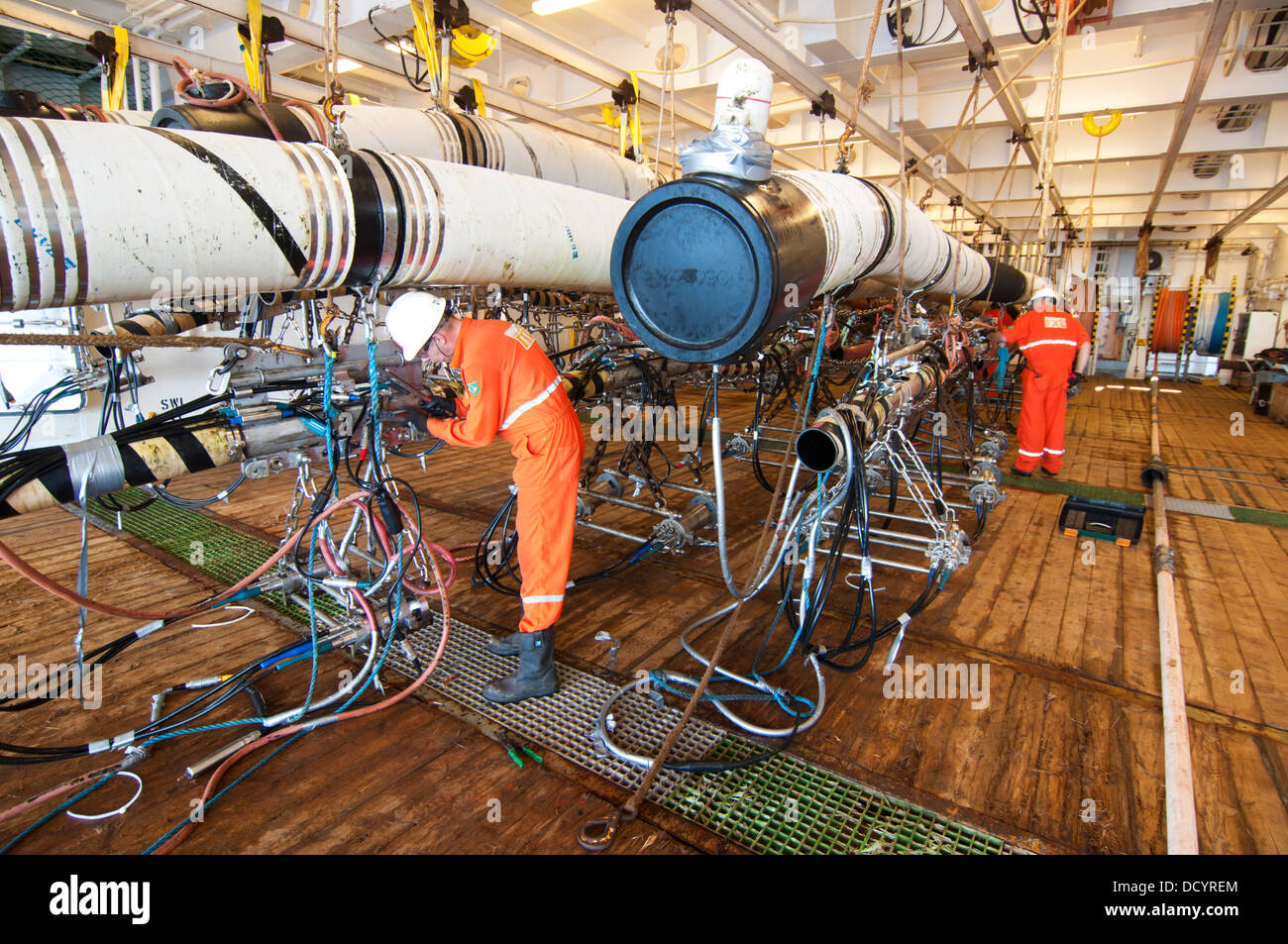 Gun Mechanics working on Seismic Air guns at Gun Deck in the seismic