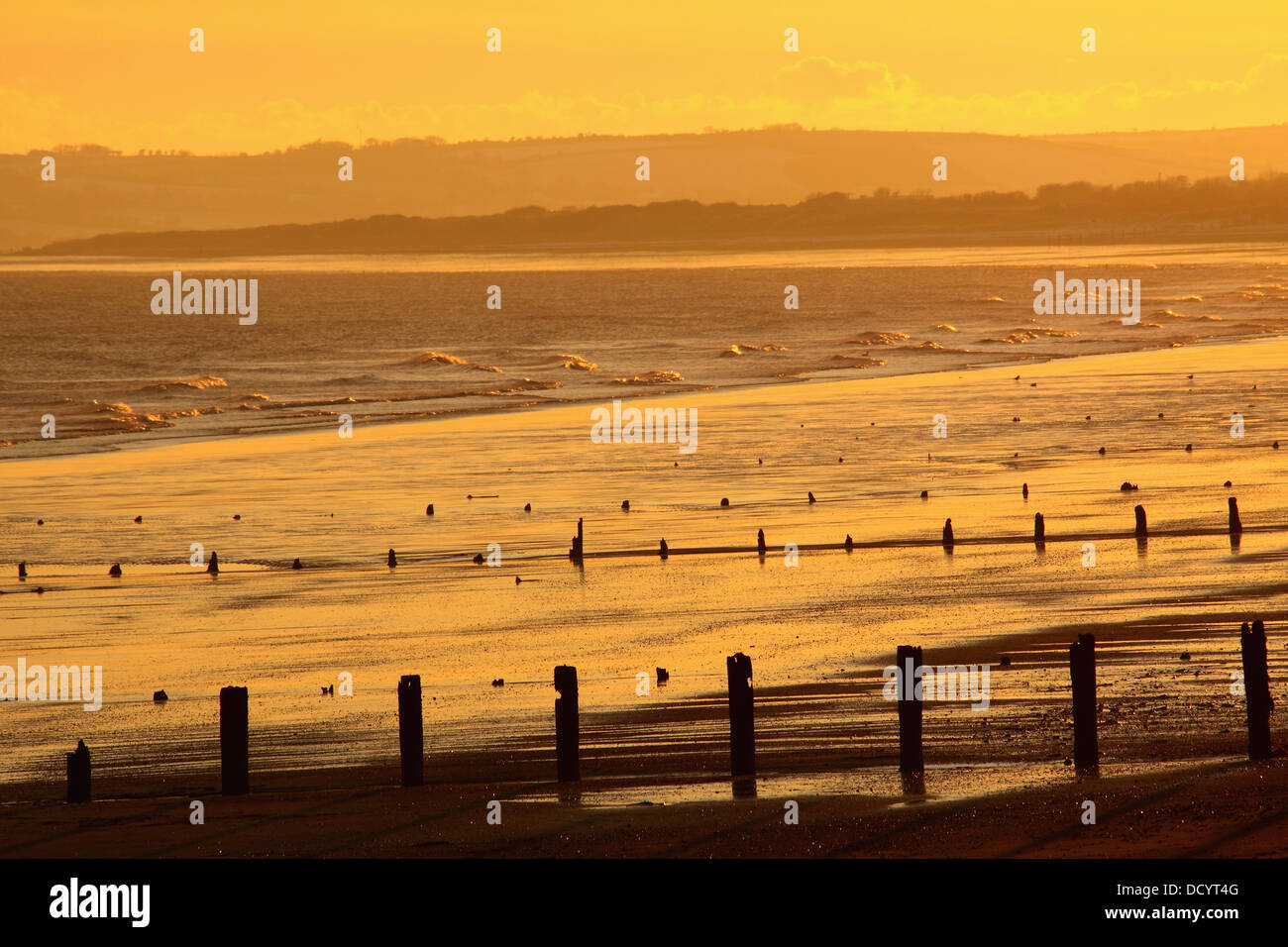 Sunset Over Beach In Winter; Youghal Beach, East Cork, Ireland Stock