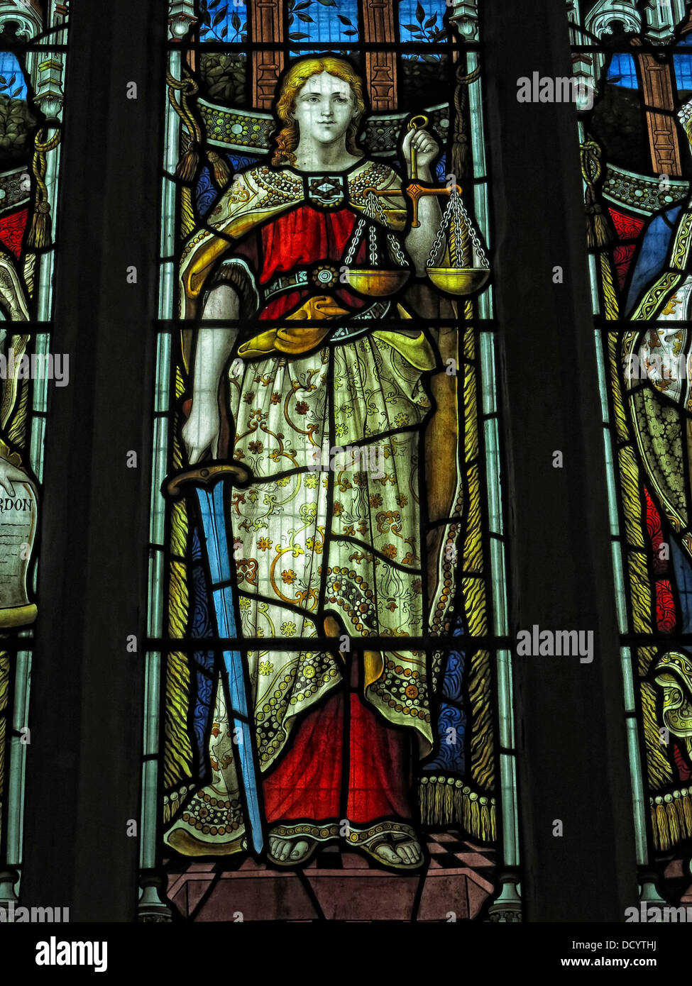 Lady Justice,Scales of justice, Stained glass window,church window, Justice - Iustitia or Justitia - asylum seekers rights under threat in Britain Stock Photo