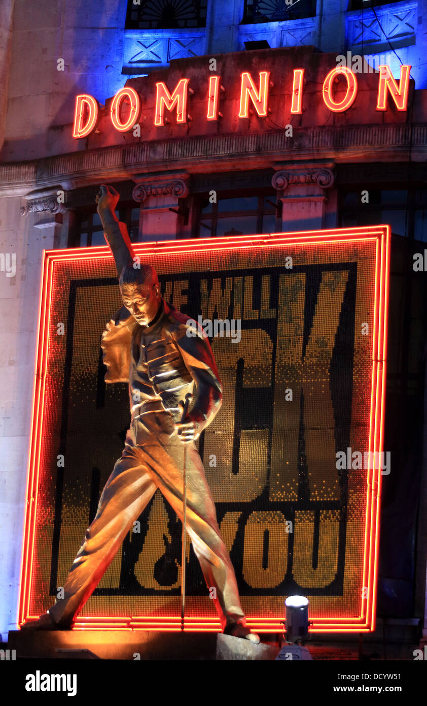 The outside of the Dominion Theatre at night with the advert for the Rock Stage Show 'We Will Rock You' Stock Photo