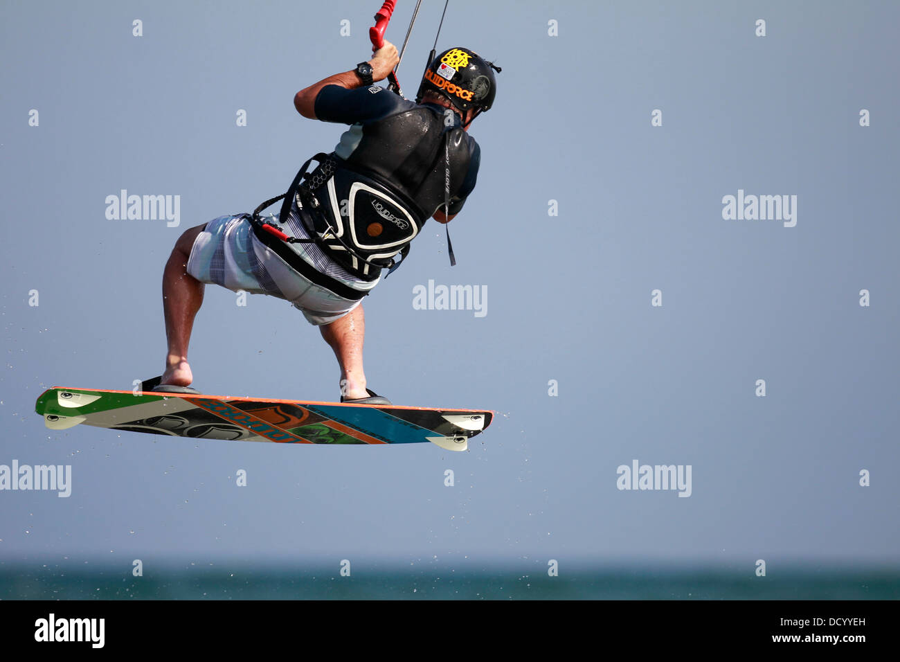 A kiteboarder in midair over a lake Stock Photo Alamy