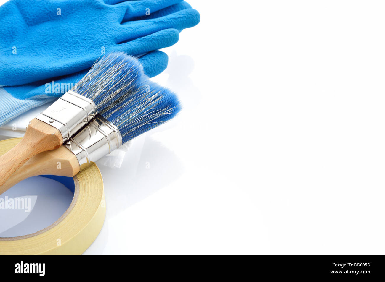 Painting tools on white background. Masking tape, brushes, drop cloth