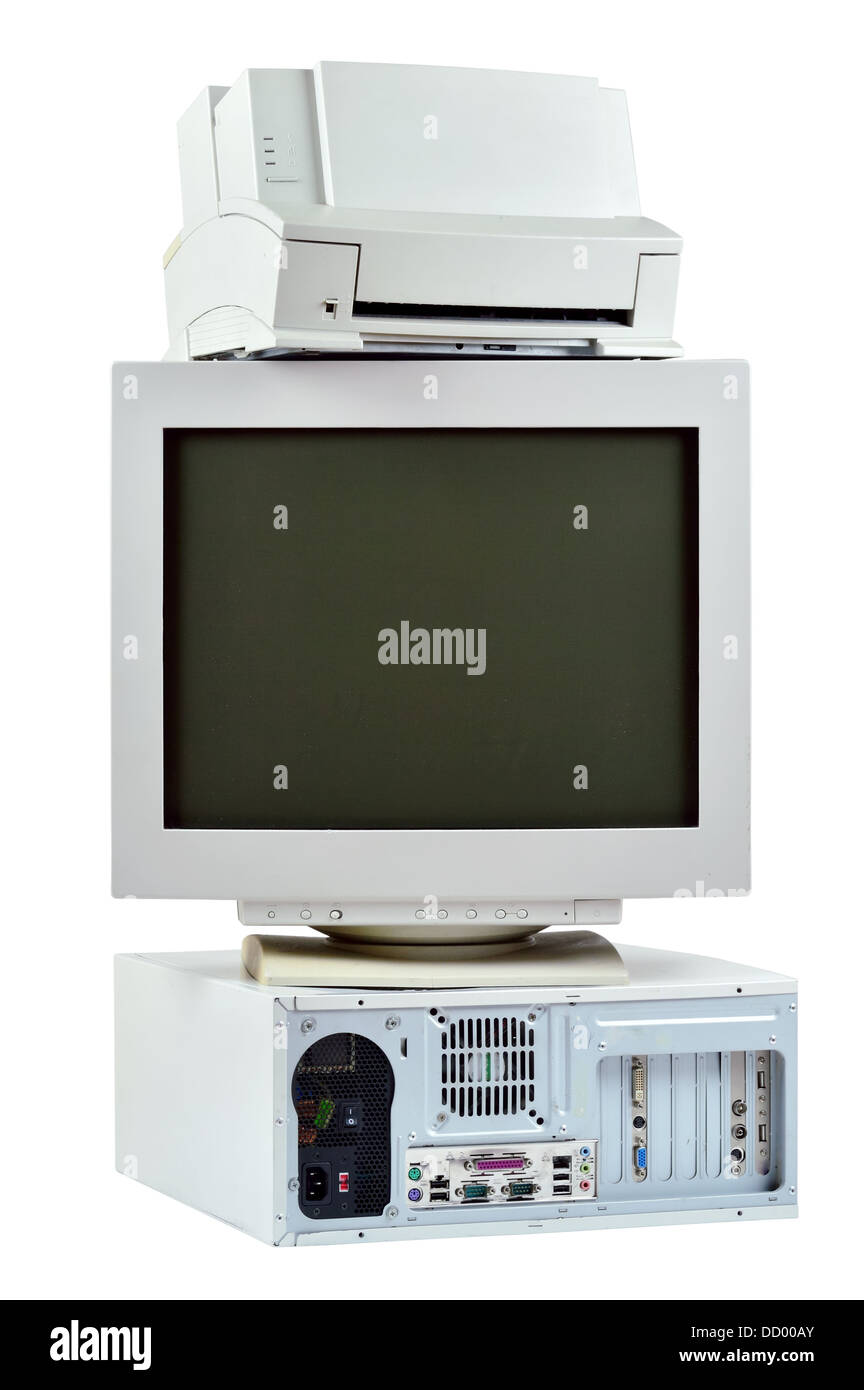 Obsolete PC commuter, printer and CRT monitor. Stack of old, used computer, monitor and printer, electronic waste isolated. Stock Photo