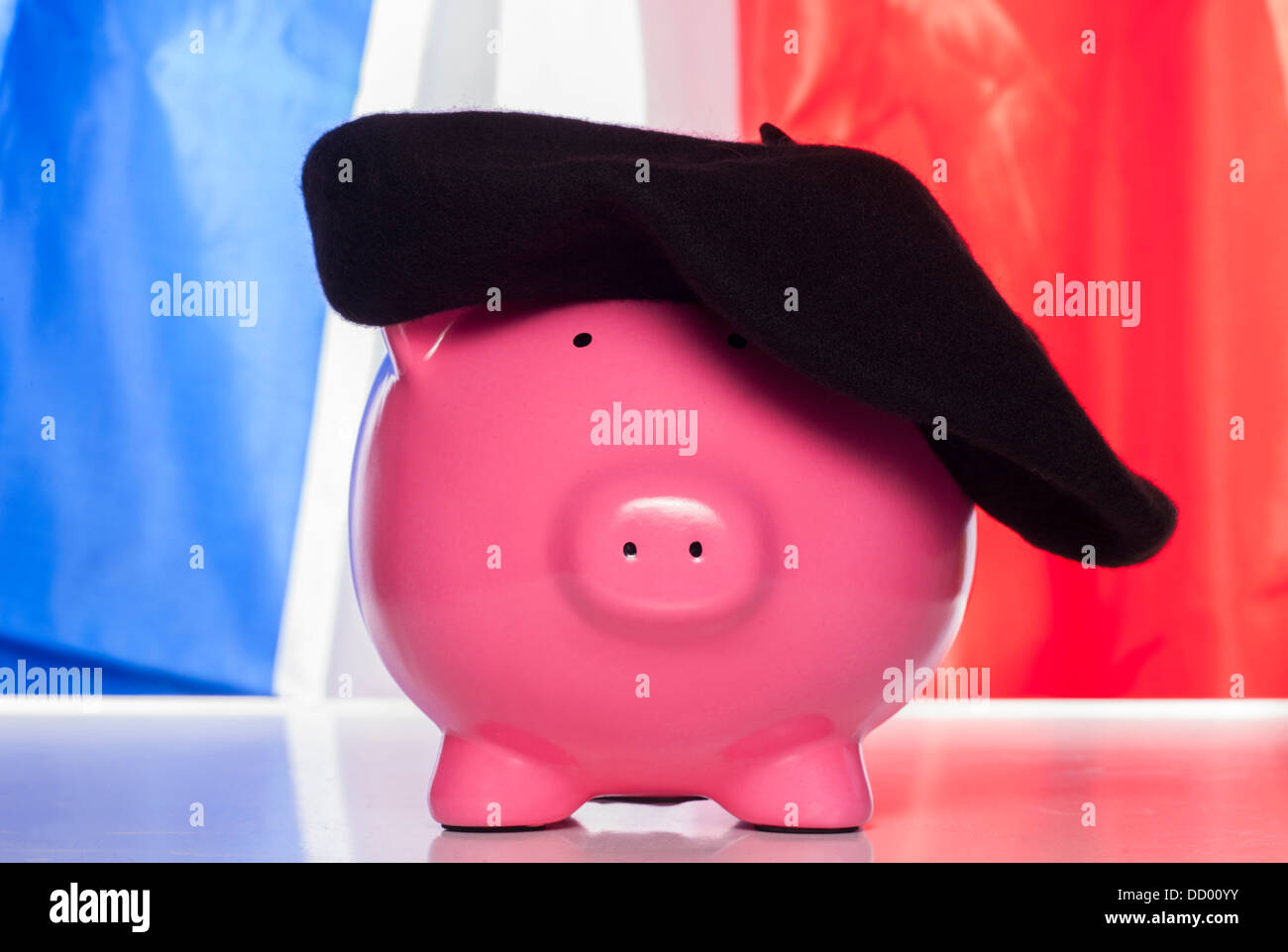 pig piggy bank on a french flag Stock Photo