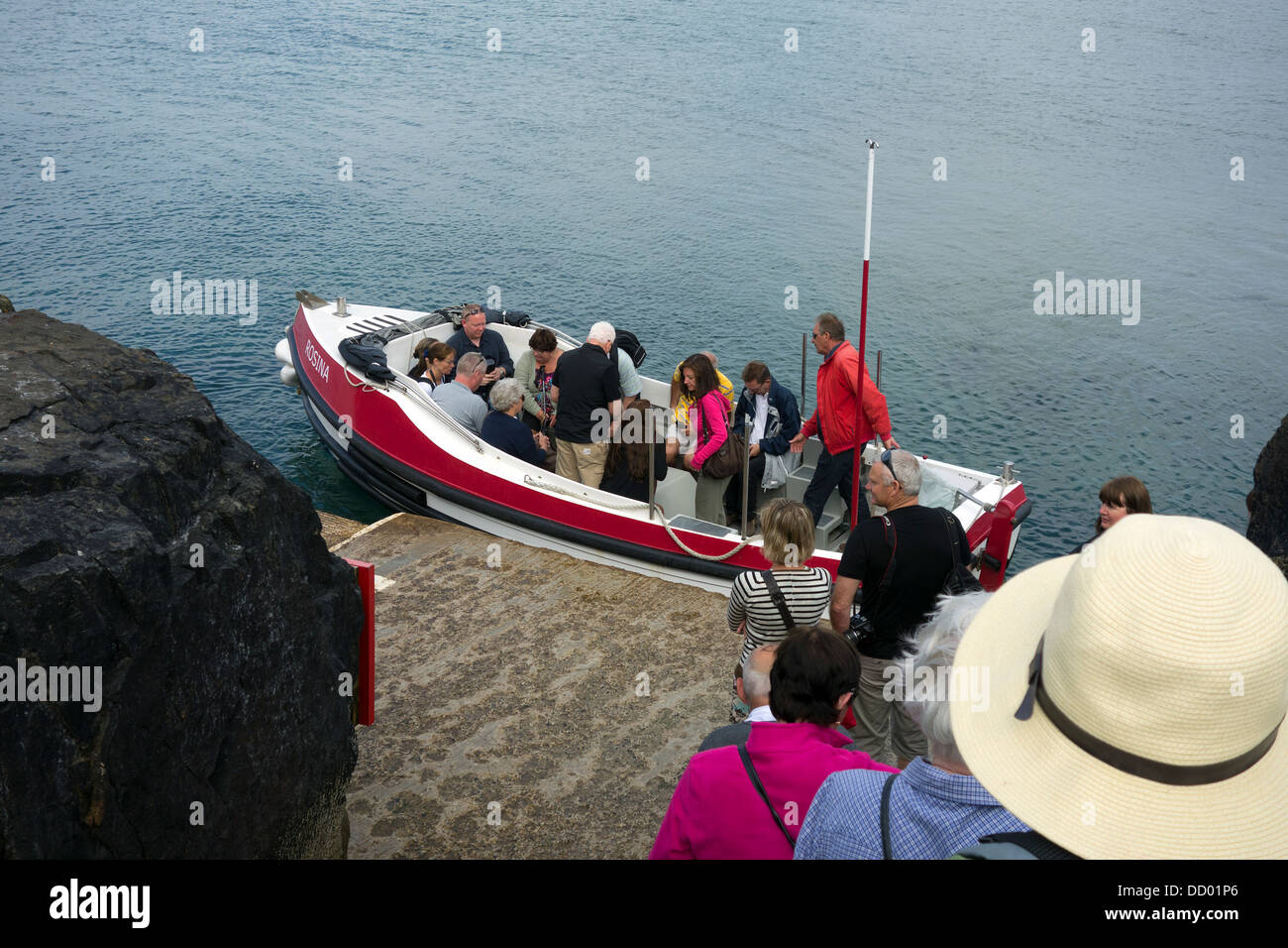 Visitors to St.Michaels Mount in Cornwall take the ferry to the island at high tide Stock Photo