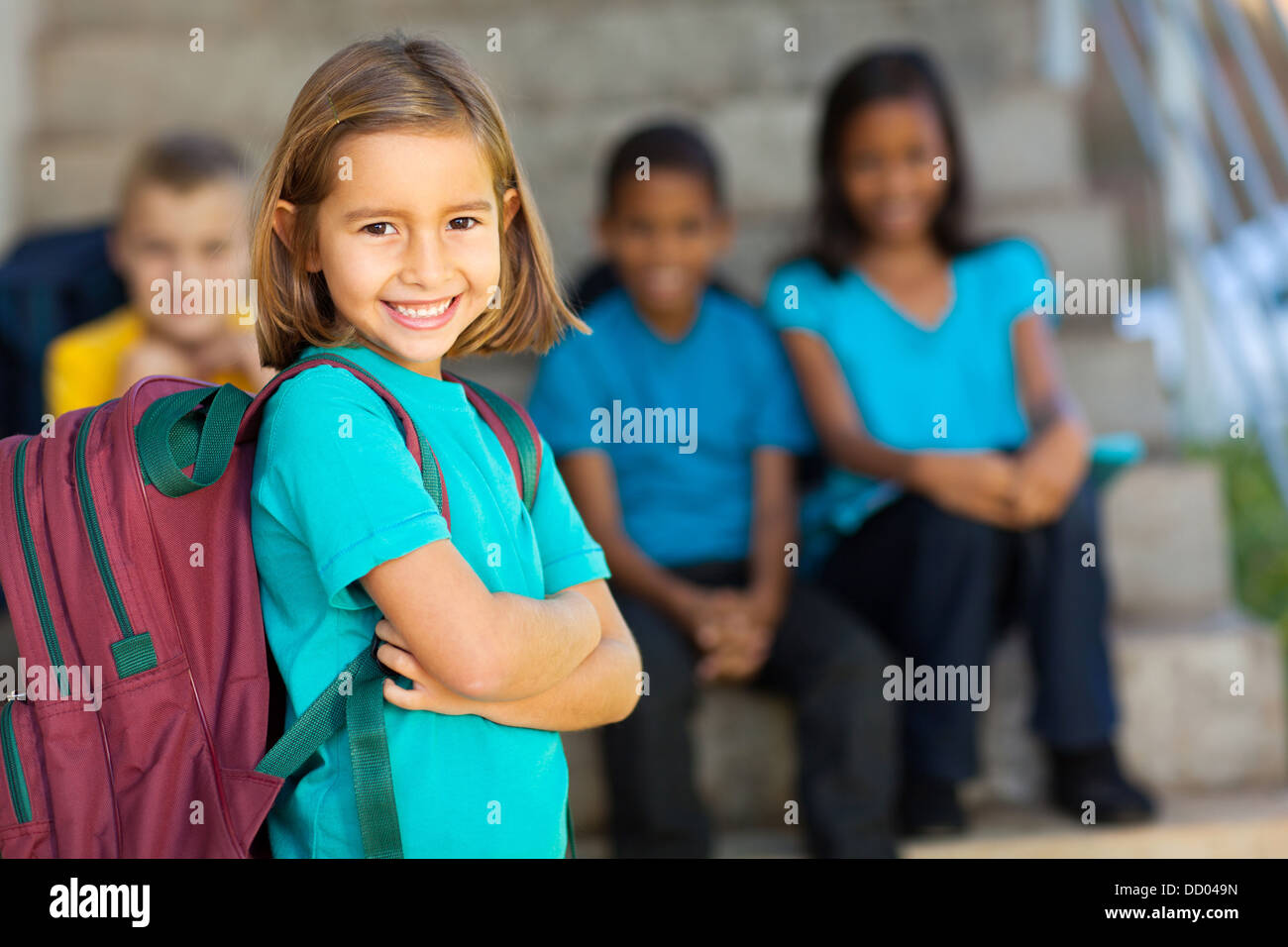 portrait of pretty preschool girl with backpack outdoors Stock Photo