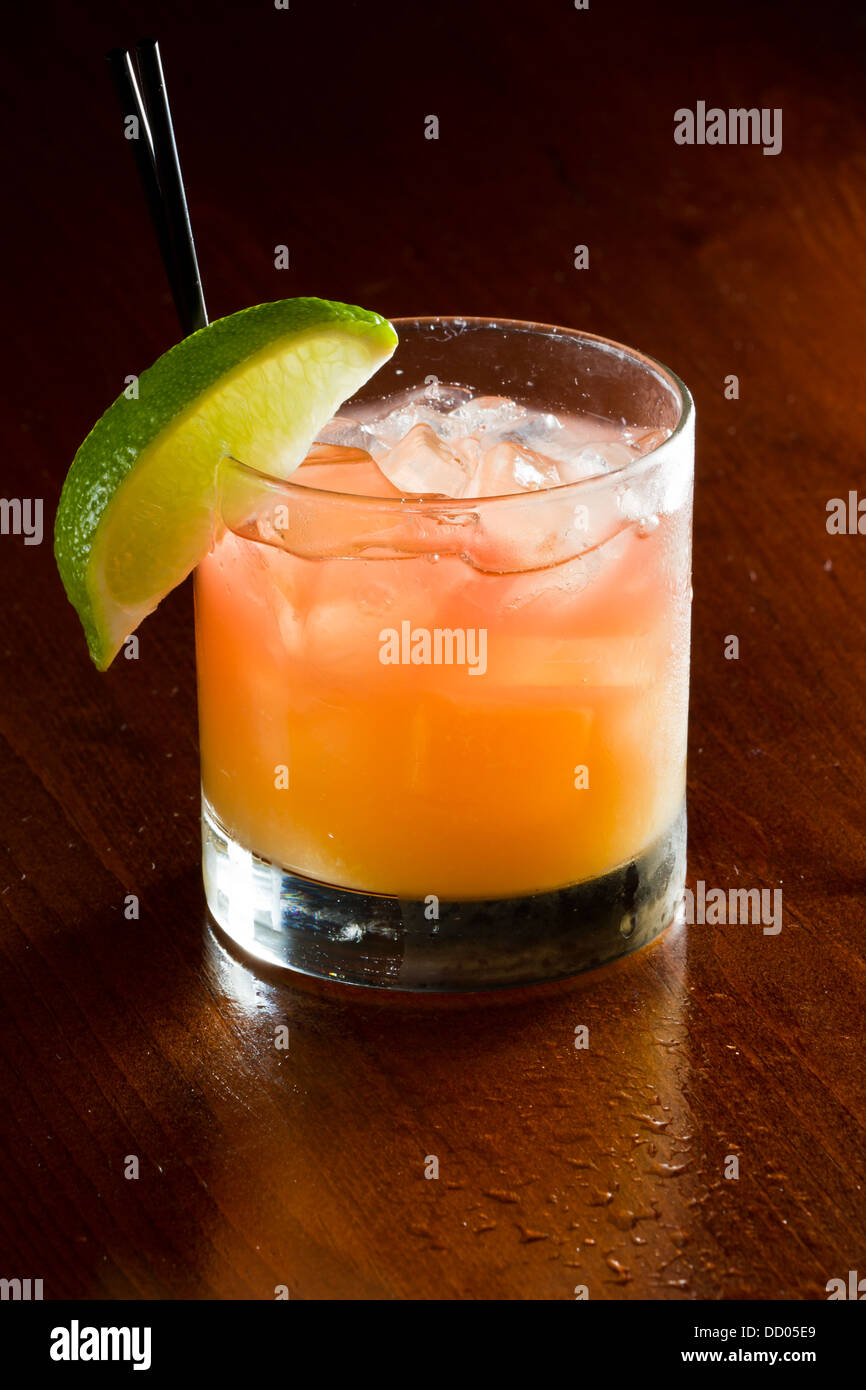 classic cocktail, madras, vodka cranberry and orange juice served in a  glass on a dark bar Stock Photo - Alamy
