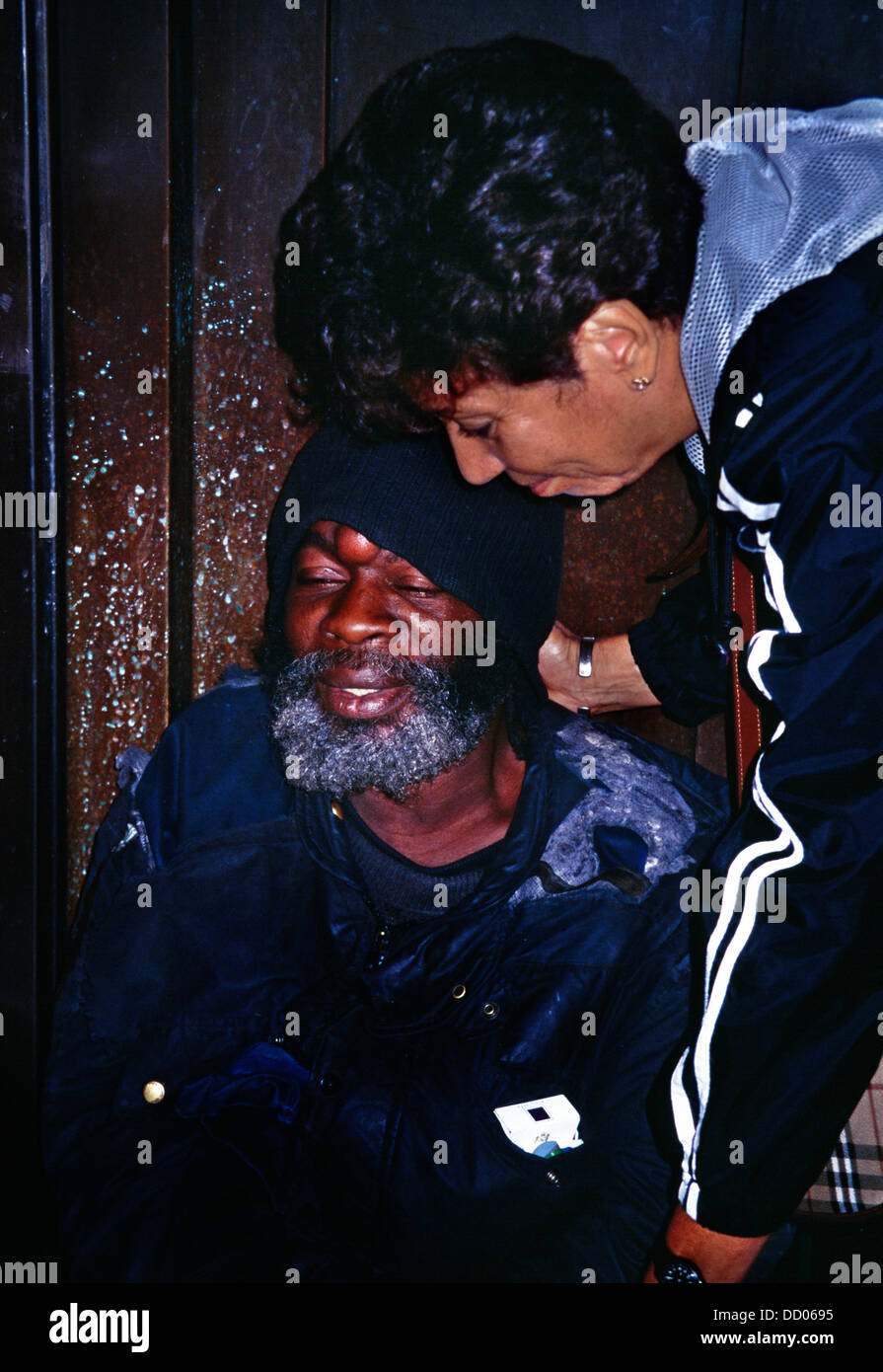 Kensington London Homeless Guyanan Man & Cuban Woman Praying Stock Photo