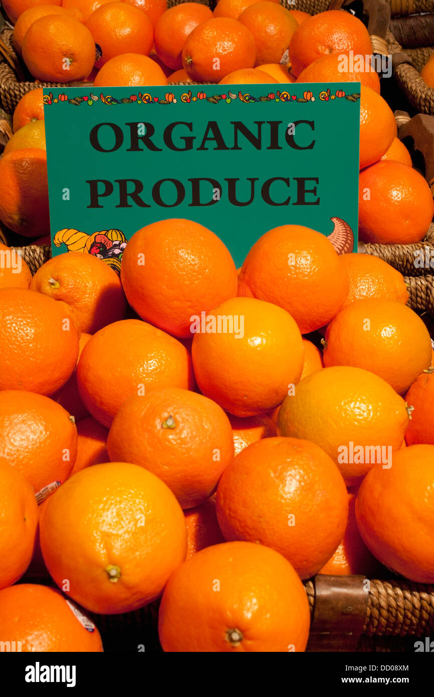 Oranges With A Sign Labeled Organic Produce; Waterloo, Quebec, Canada