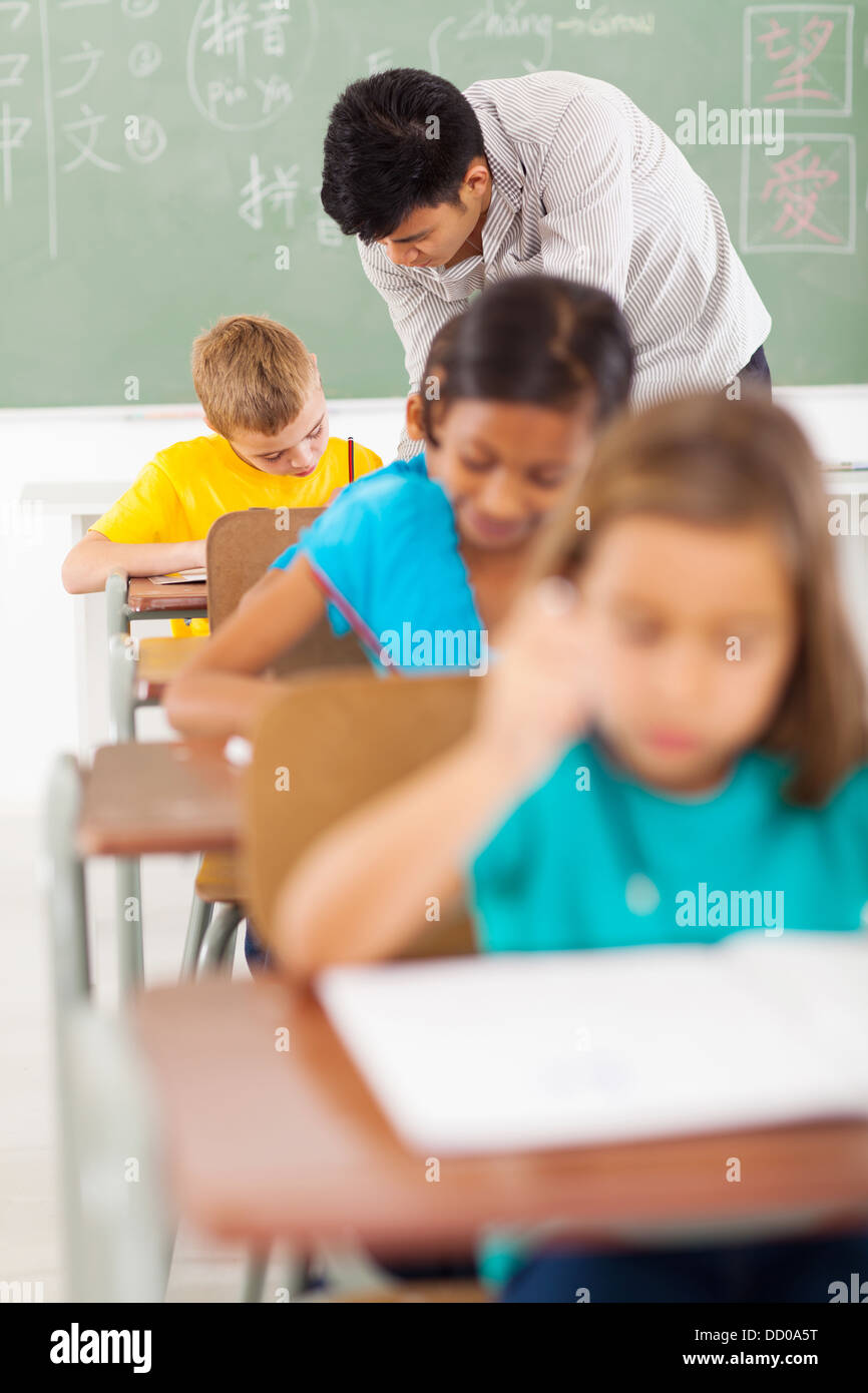 chinese language teacher and students in classroom during lesson Stock Photo