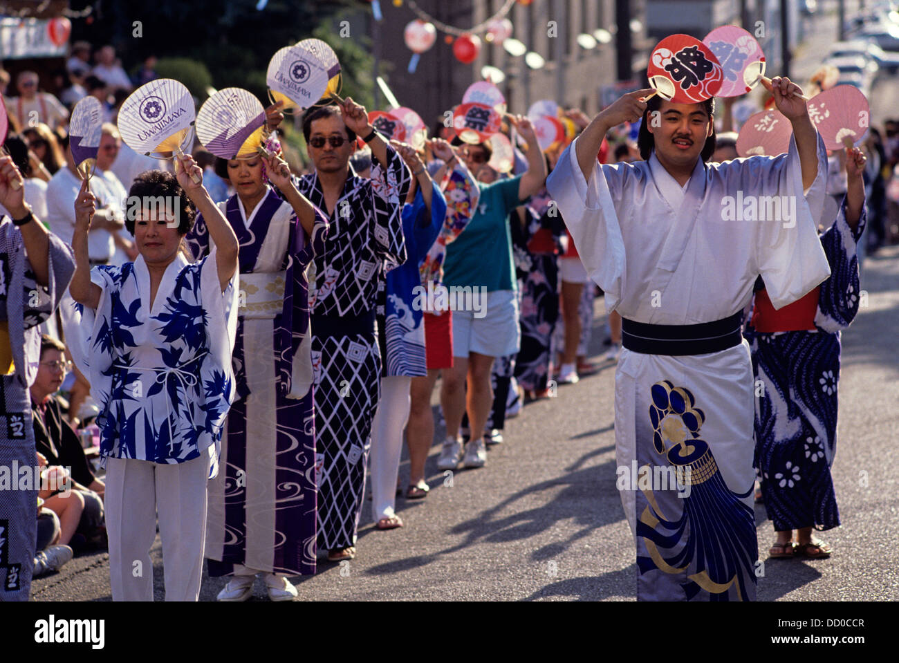 Bon Odori celebration and parade with dancers with fan celebrating
