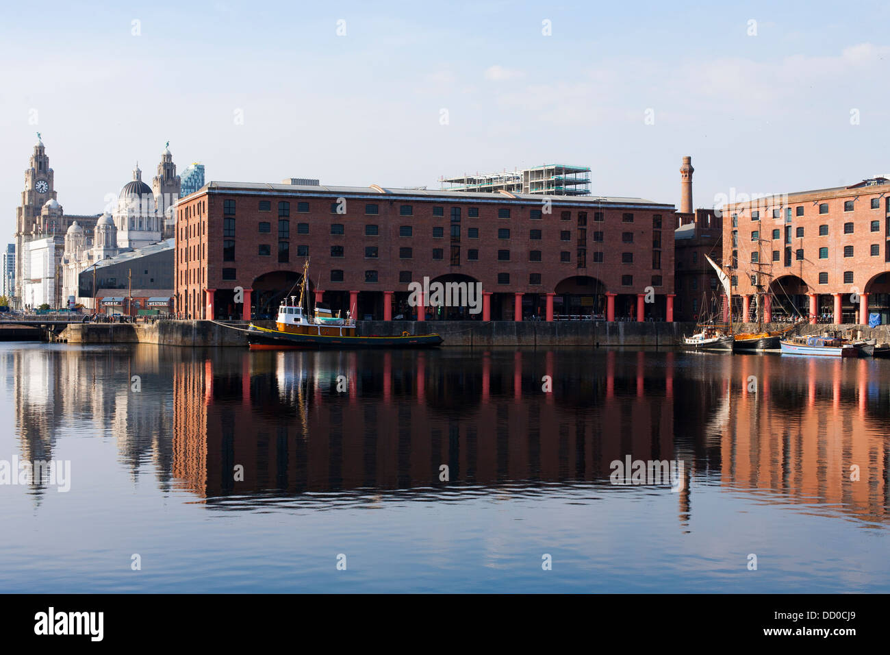 Buildings that make up part of the Albert Dock in Liverpool port and harbor reflect in the water Stock Photo