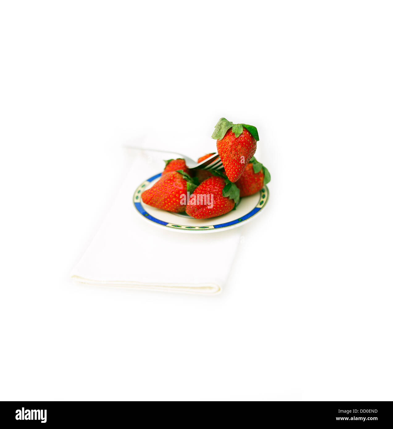 fresh strawberries dish over white Stock Photo - Alamy