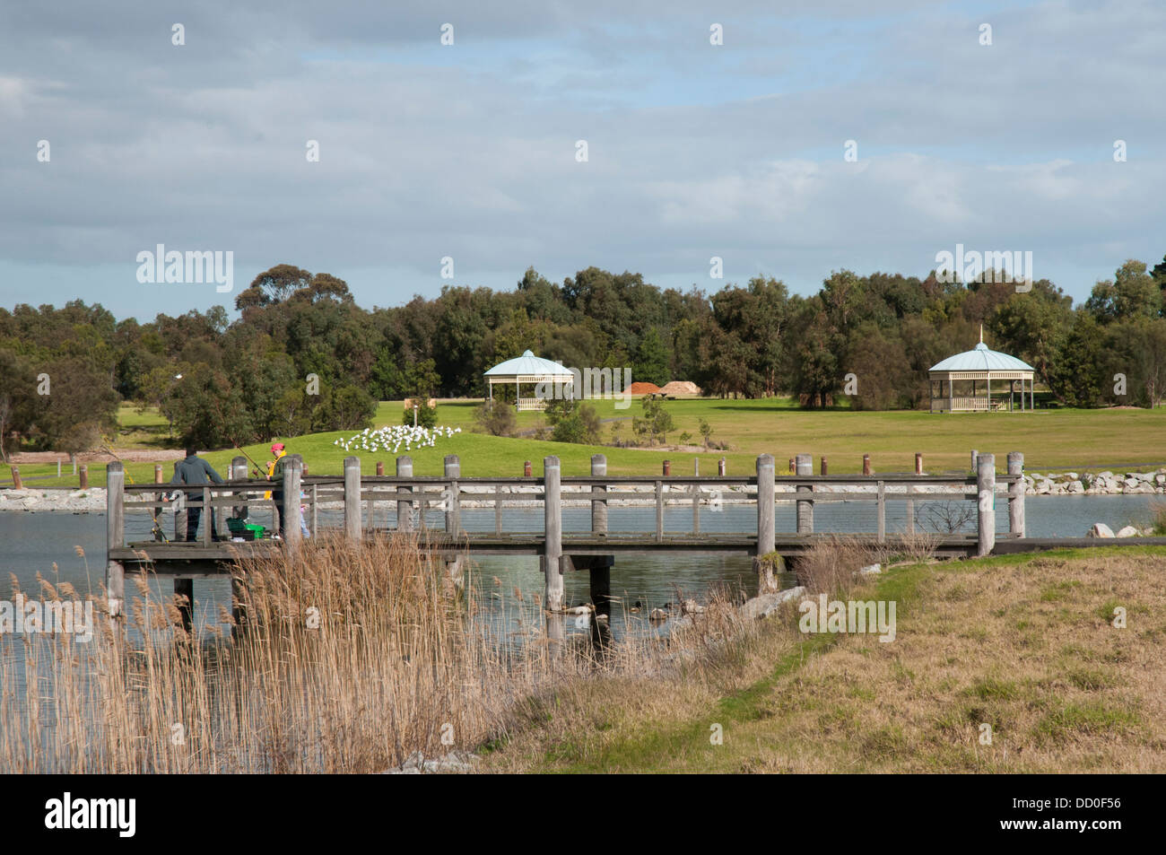 Recreational fishermen at Karkarook Park, a man-made parkland in Moorabin, Melbourne Stock Photo