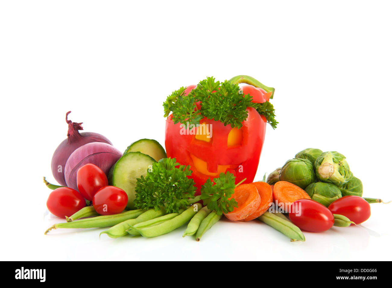 Funny paprika with vegetables Stock Photo