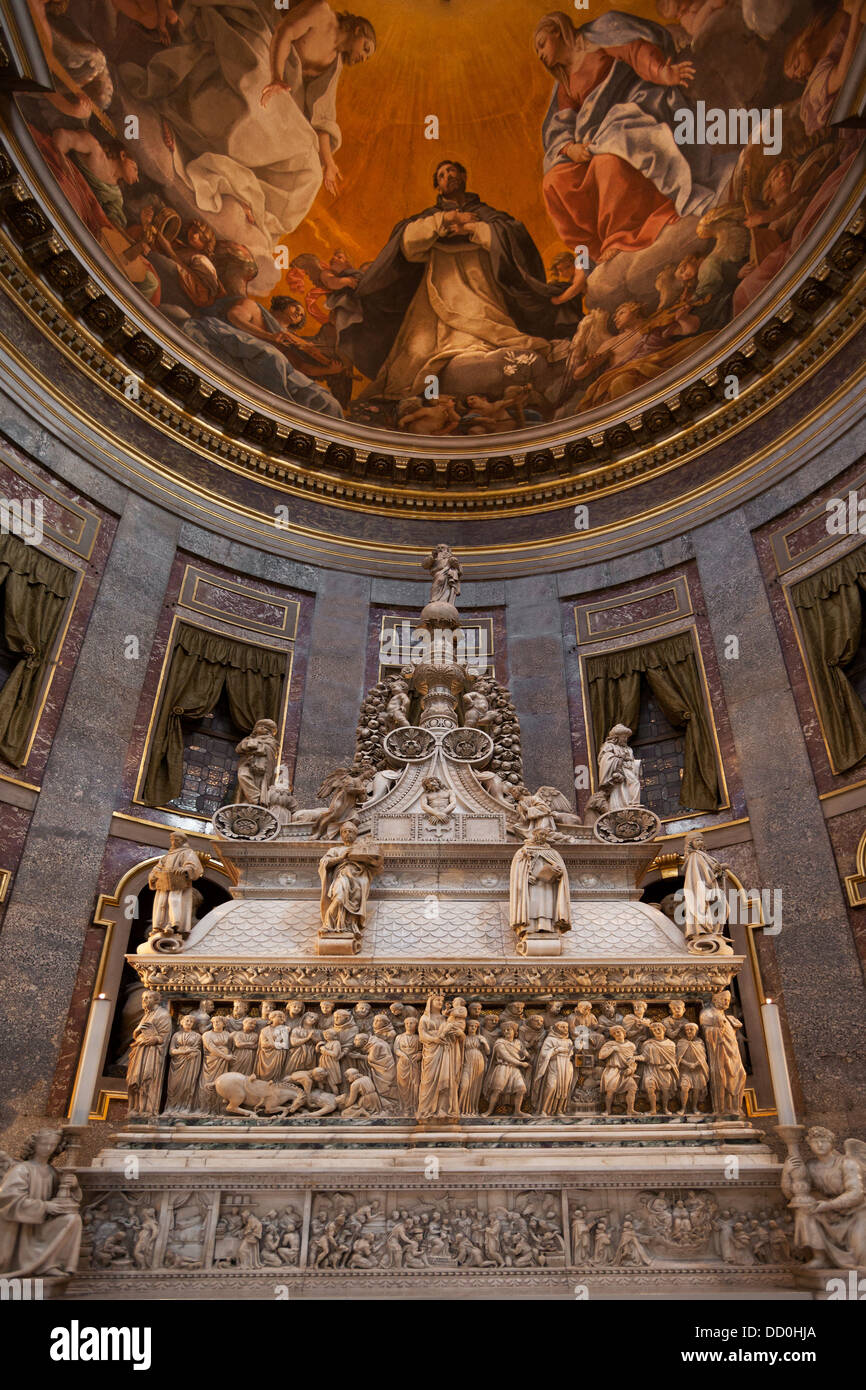Frescoed ornate ceiling and cupola, with ornate carved marble sarcophagus below, in chapel of San Domenico, Bologna Italy Stock Photo