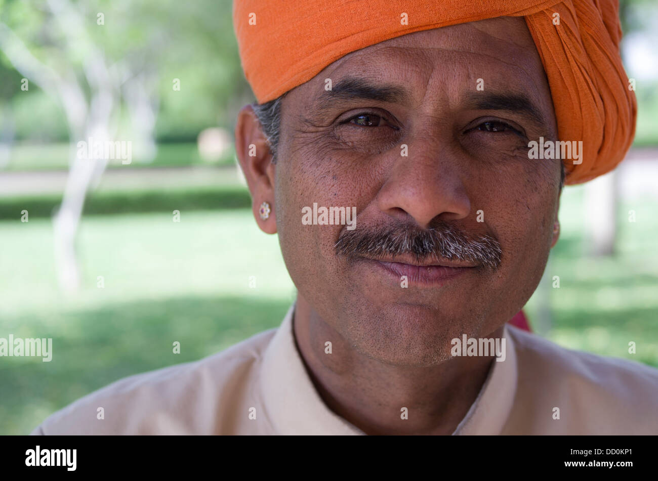 Indian man with mustache and orange turban - Jodhpur, Rajashtan, India Stock Photo