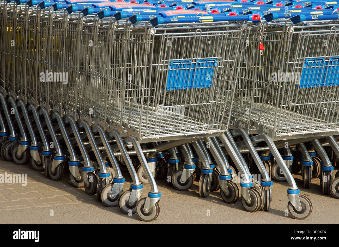A row of parked shopping carts equipped with coinoperated locking