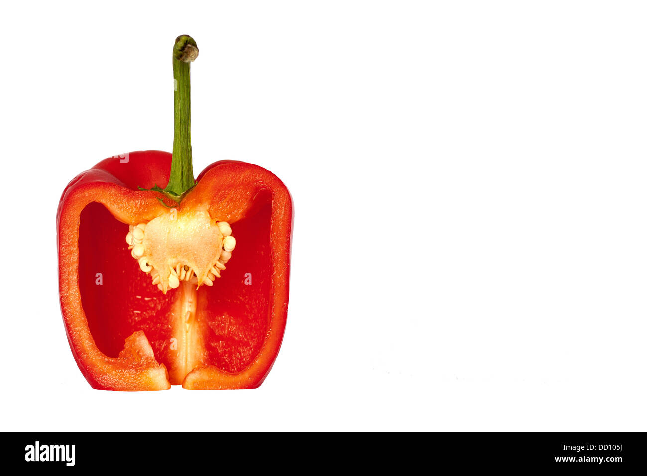 A red bell pepper from the side cut open and isolated Stock Photo