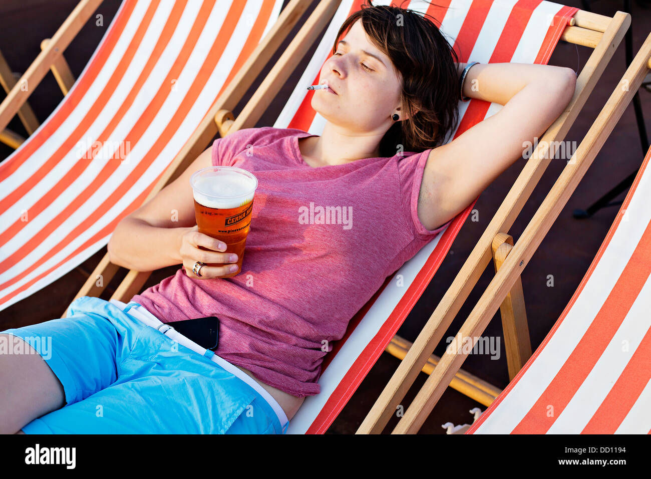 young lady, woman, girl, beer, relax, cigarette, smoking, smoke, summer Stock Photo