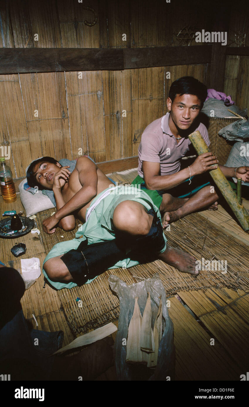 Lahu men smoking opium and marijuana. Near Mae Hong Son. Thailand. Stock Photo