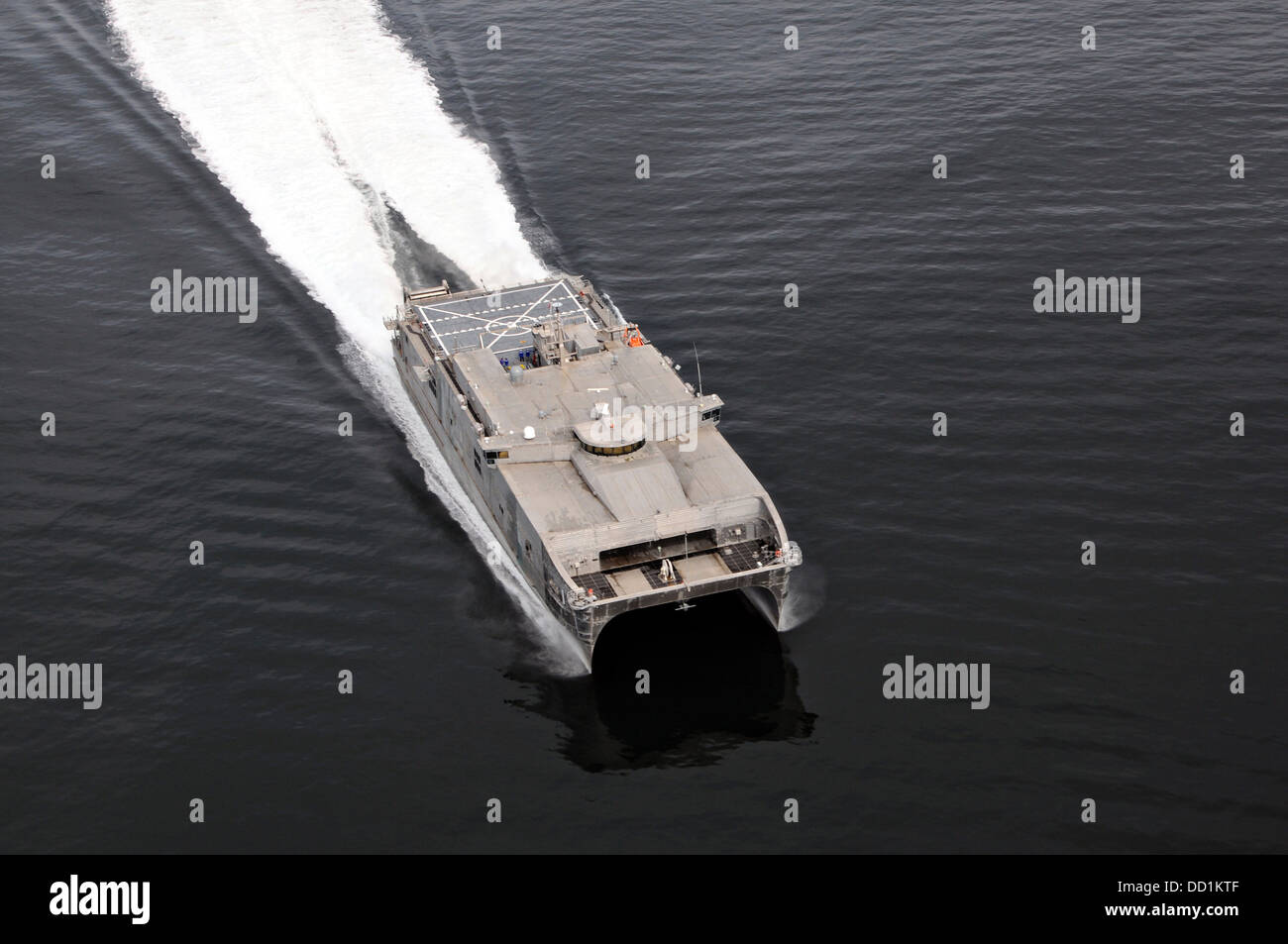 US Navy Military Sealift Command joint high-speed vessel USNS Spearhead conducts high-speed trials August 20, 2013 off the coast of Virginia. The USNS Spearhead reached speeds of 40 knots during the testing. Stock Photo