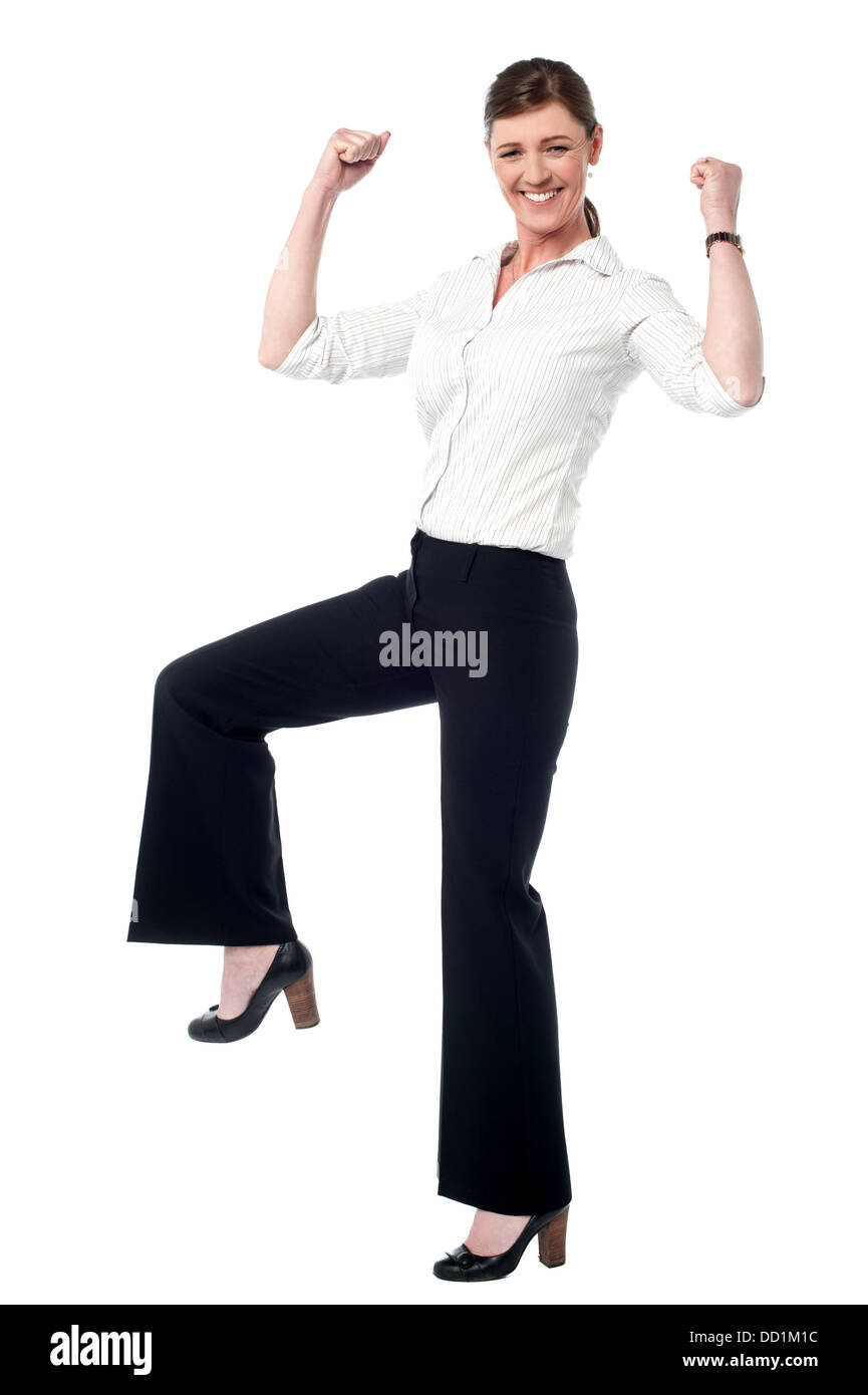 Full length image of an excited female team leader Stock Photo - Alamy