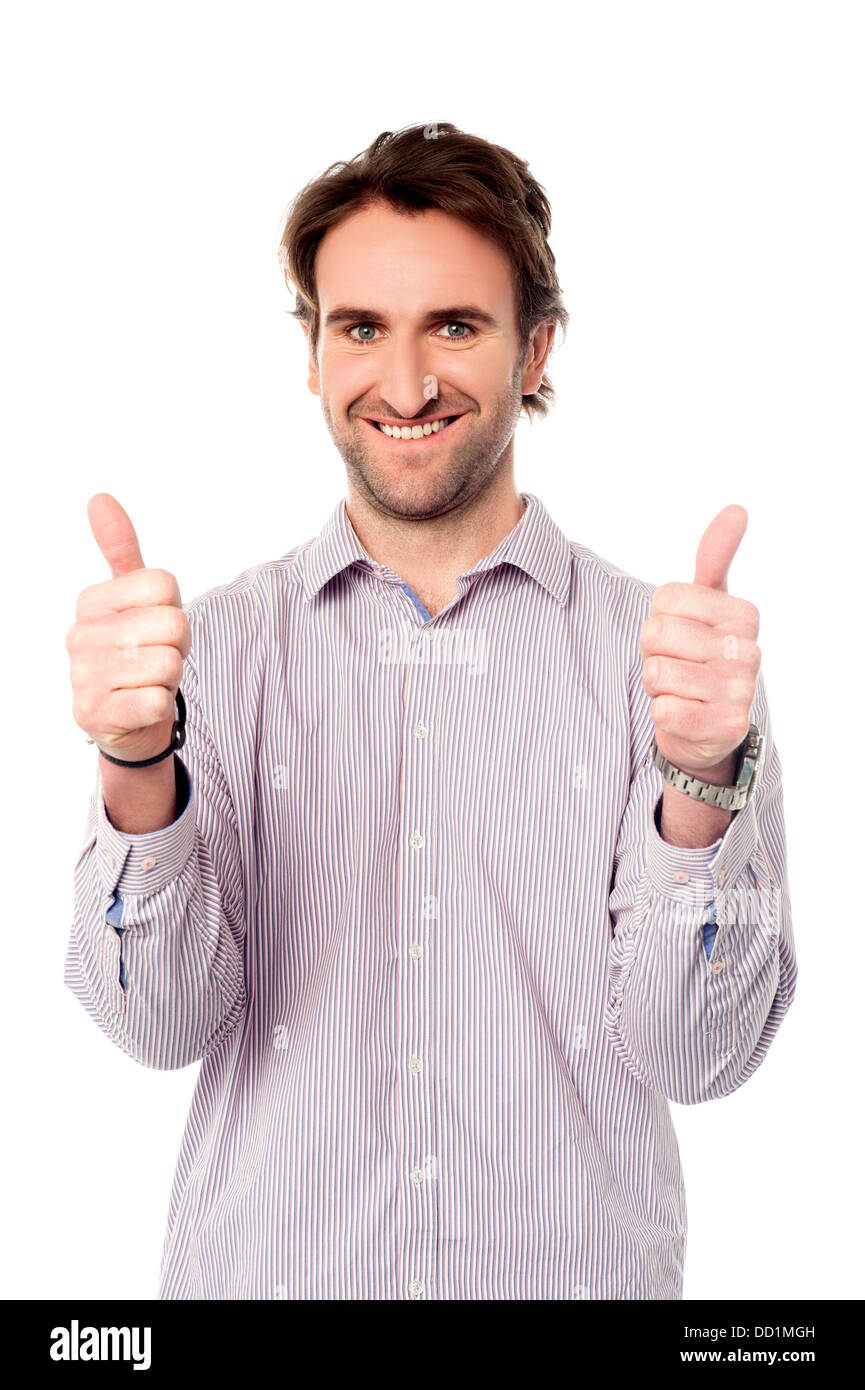 Handsome young man showing double thumbs up Stock Photo Alamy