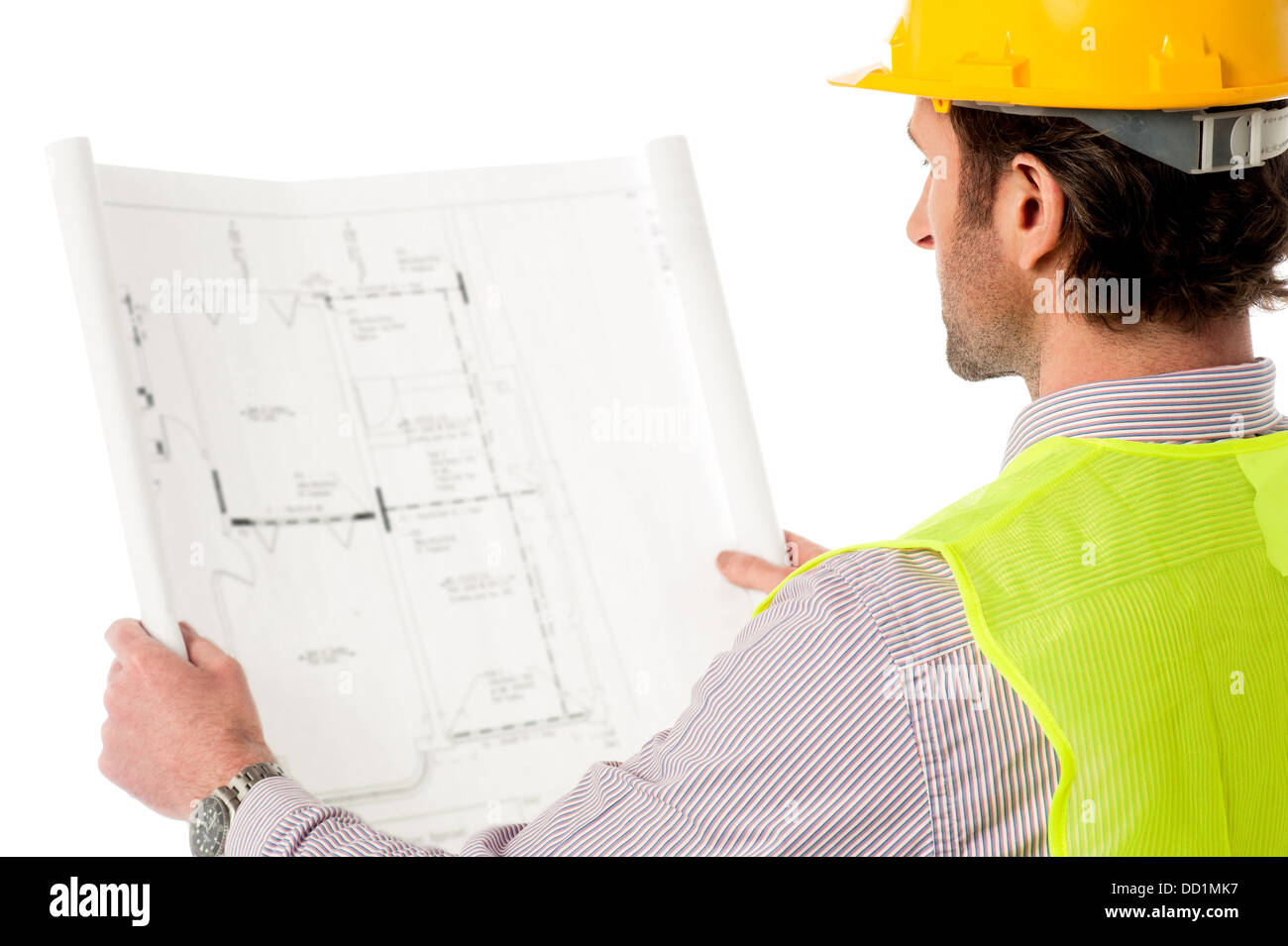 A construction worker on the job with blueprint Stock Photo Alamy