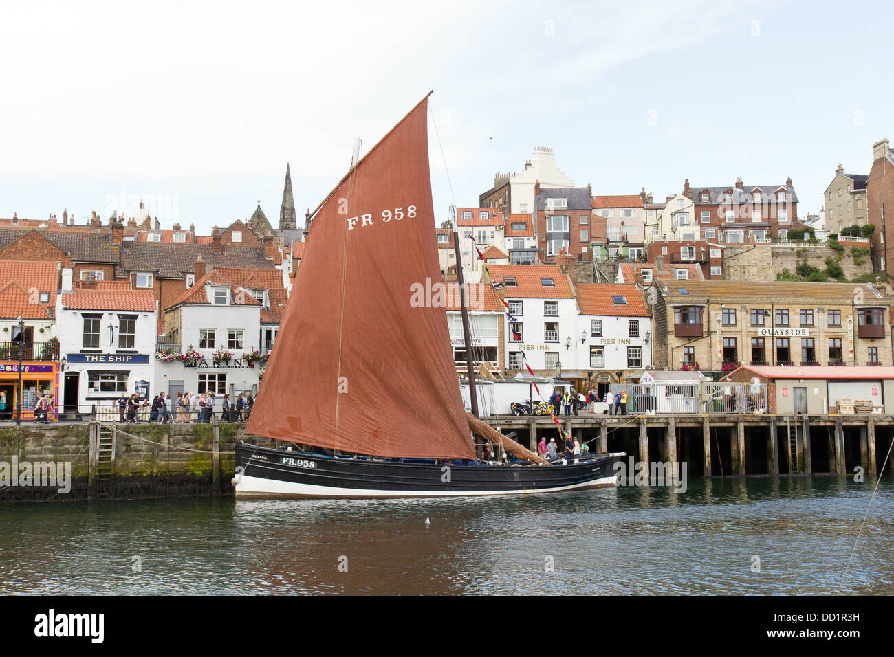 Whitby harbour with an old sailing boat - north Yorkshire, England ...