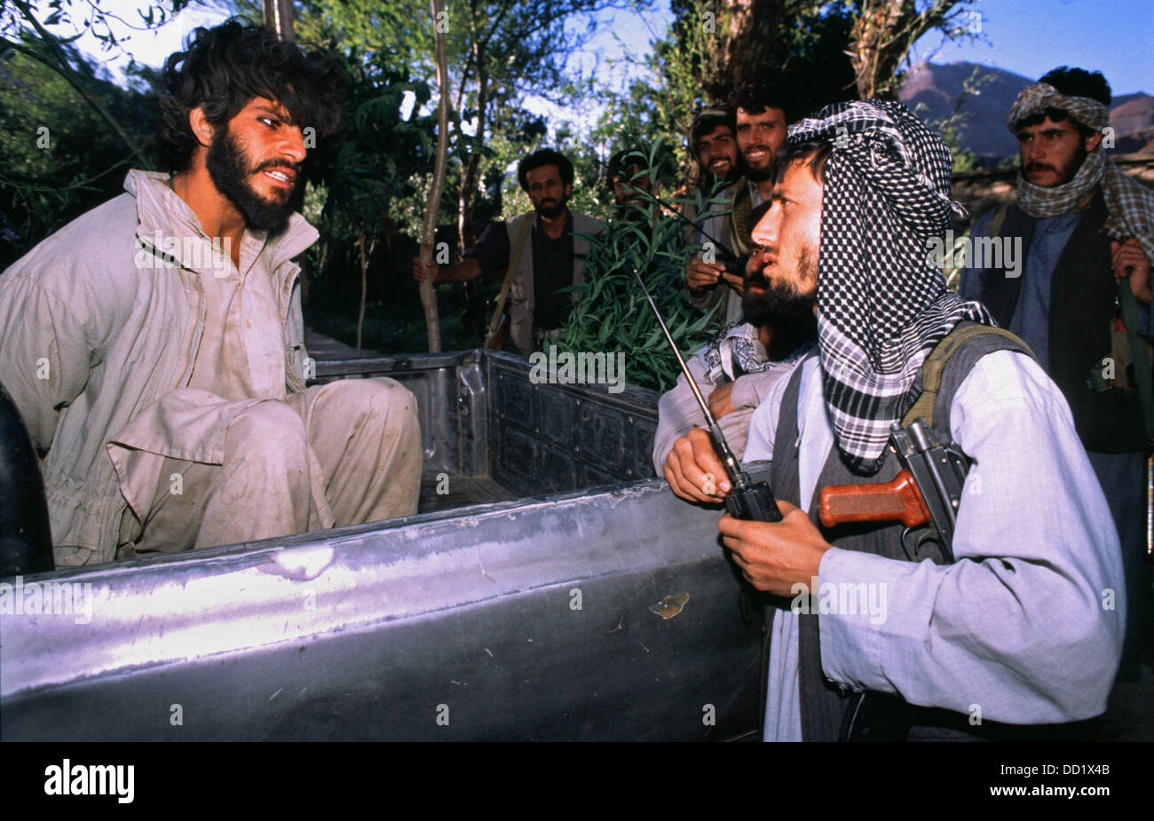 Northern Alliance commander (right) interrogates a captured Taliban fighter (left) near Charikar Afghanistan September 1999 Stock Photo