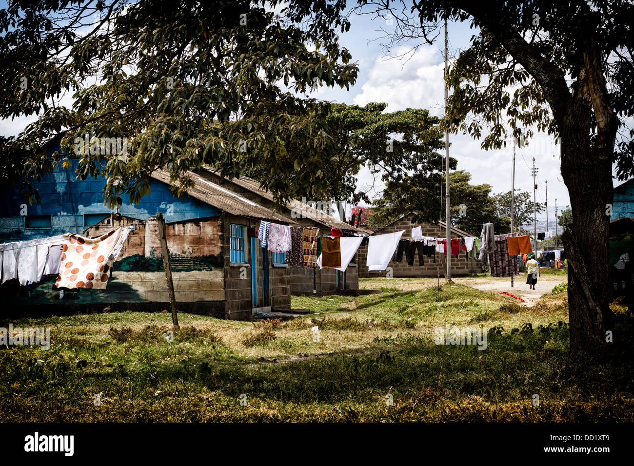 Nakuru town laundry hanging in front of brightly painted brick houses