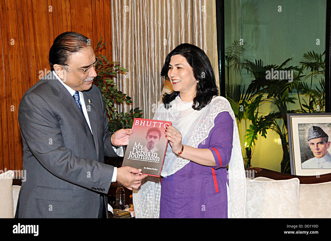 Islamabad, Pakistan. 23rd Aug, 2013. DR.ms shaista nuzhat presenint her book to present asif ali zardari at the president palace 23 august 2013    Handout by Pakistan informtion department      (Photo by PID/Deanpictures/Alamy Live News) Stock Photo