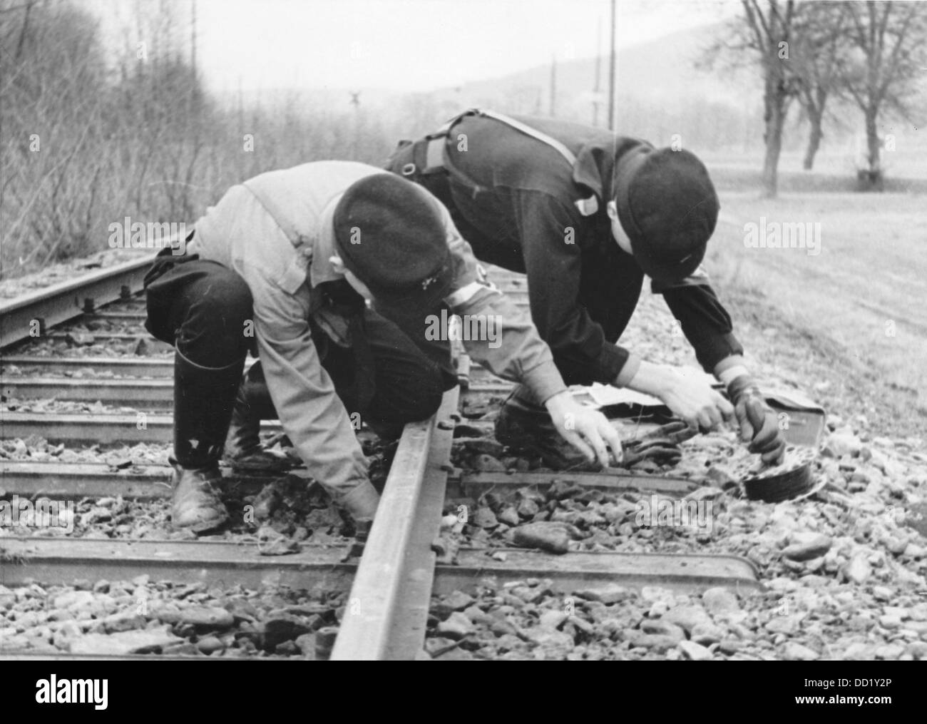 The image from the Nazi Propaganda! shows members of the communications branch of the Hitler Youth laying radio cables near Berka in Germany. Date unknown. Fotoarchiv für Zeitgeschichte Stock Photo